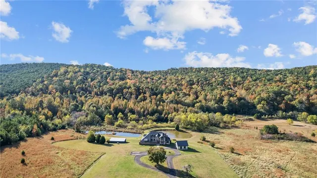 a view of a lake with a building in the background