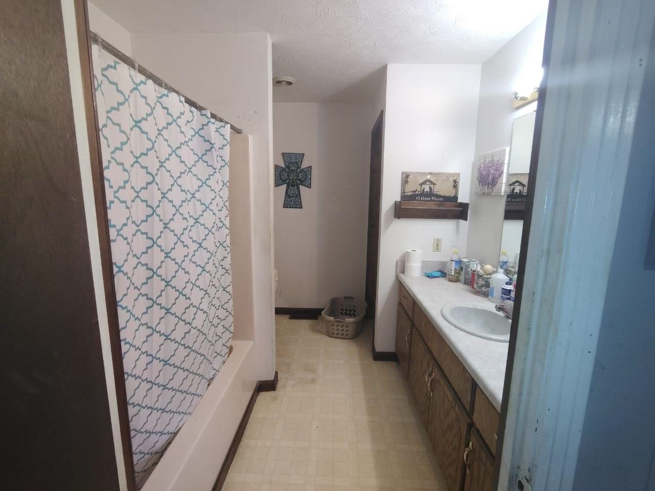 1475 Authur Byrd Road Pocahontas, TN 38061 - Photo 24 of 37 Bathroom featuring a built-in vanity with an integrated sink, a full-width mirror, and overhead lighting