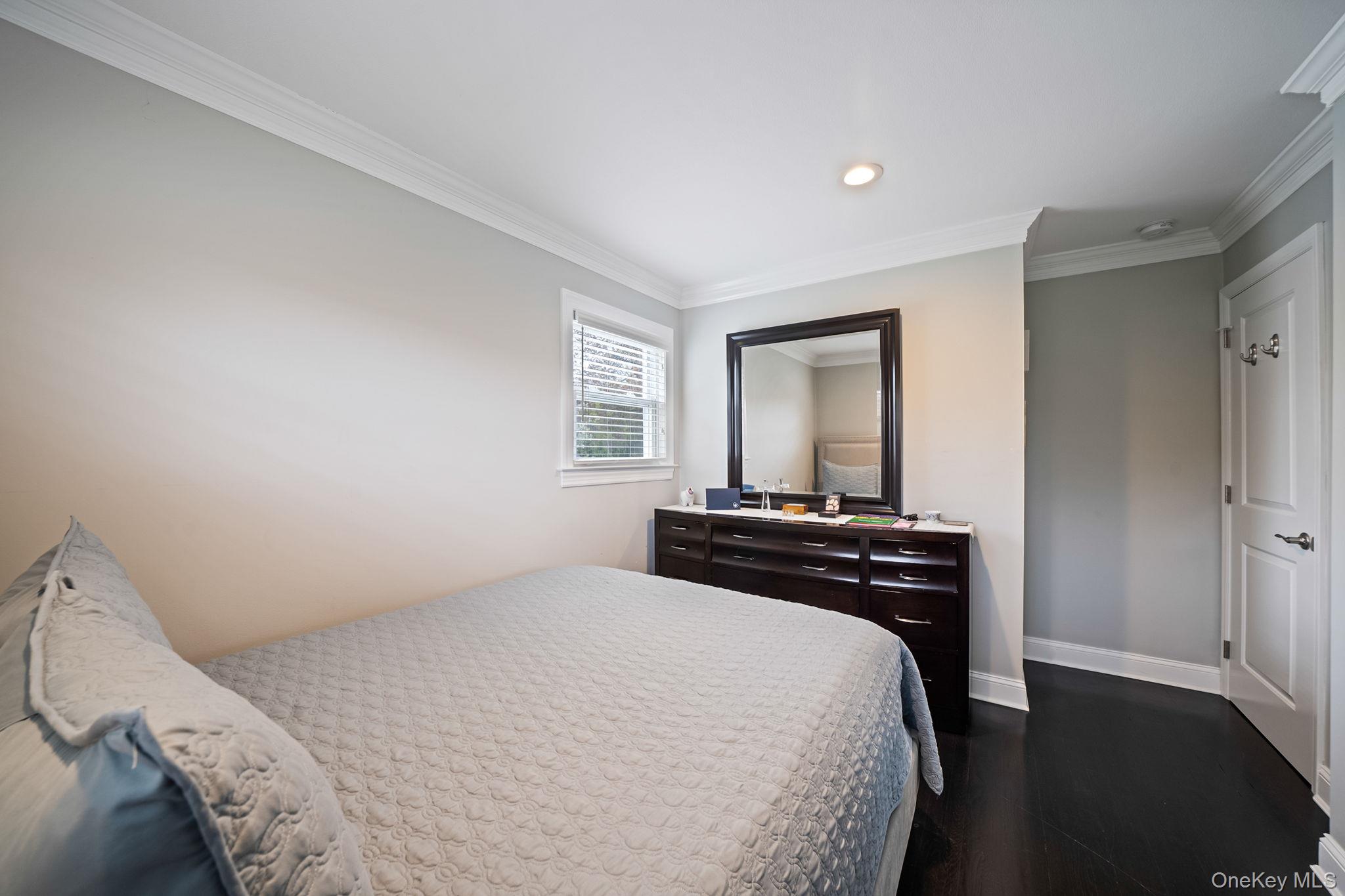 110 Stephen Road Bayport, NY 11705 - Photo 28 of 39 a bedroom with a bed and a window