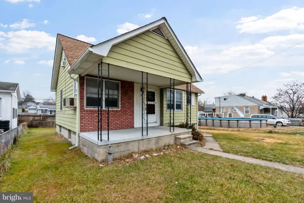 a view of a house with a yard patio and swimming pool