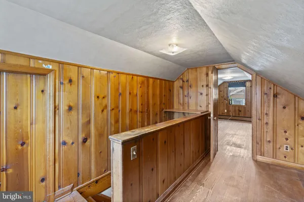 a view of a bathroom with a tub and shower