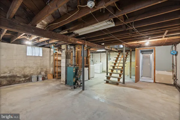 a view of an empty room with furniture