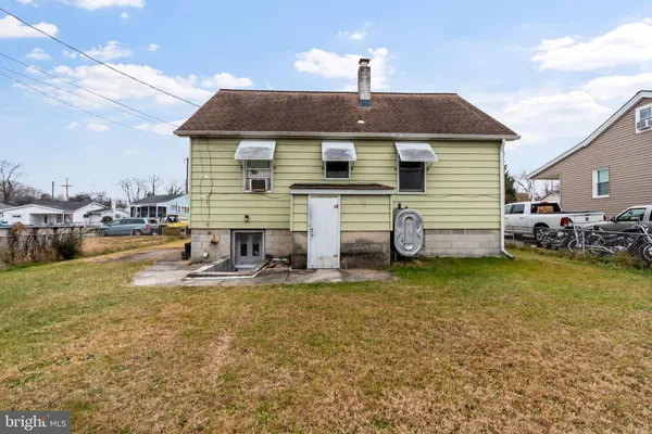 a front view of house with yard and seating area