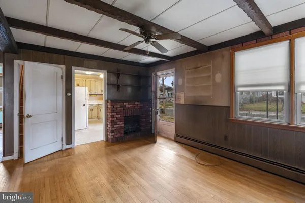 a view of an empty room with a fireplace