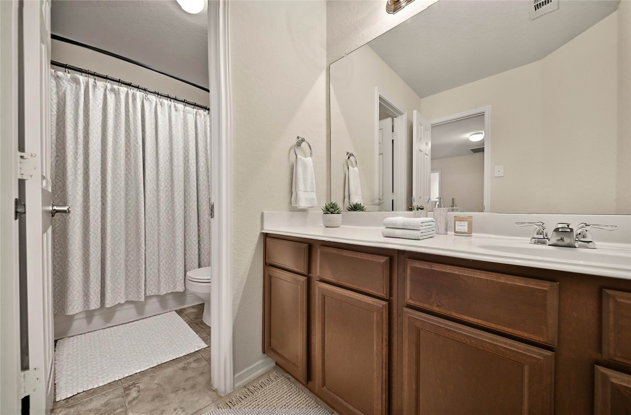 2672 Magnolia Fair Way Spring, TX 77386 - Photo 24 of 49 The upstairs secondary bath features an extended vanity with extensive storage, a separate water closet to make sharing a little easier. And a linen closet in the hallway outside for even more storage.