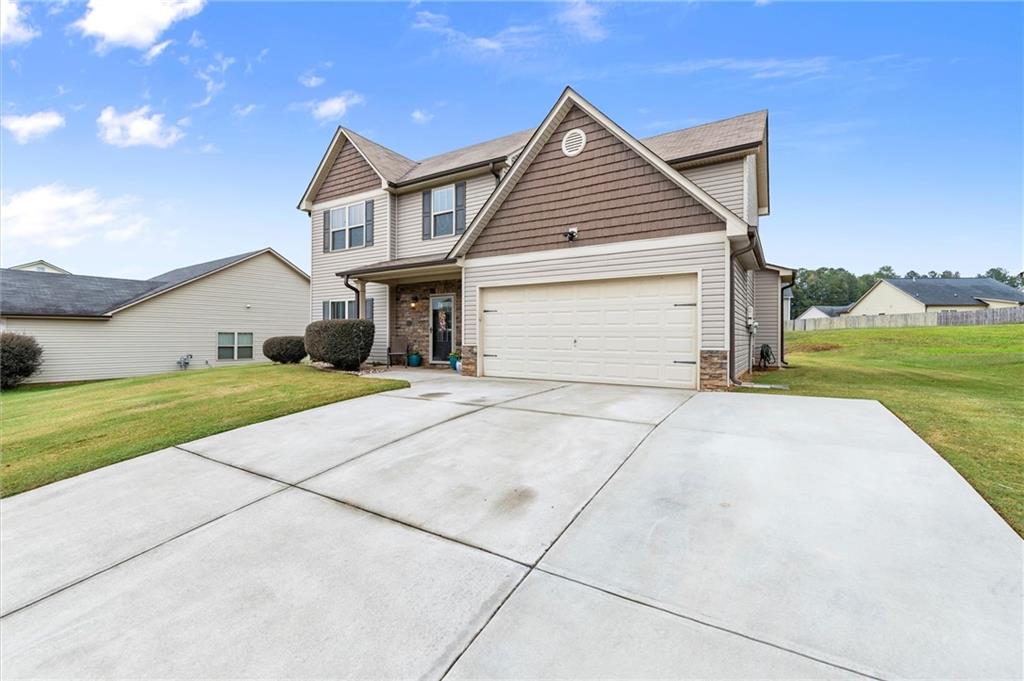 138 Brookhaven Drive Villa Rica, GA 30180 - Photo 1 of 1 a front view of house with yard