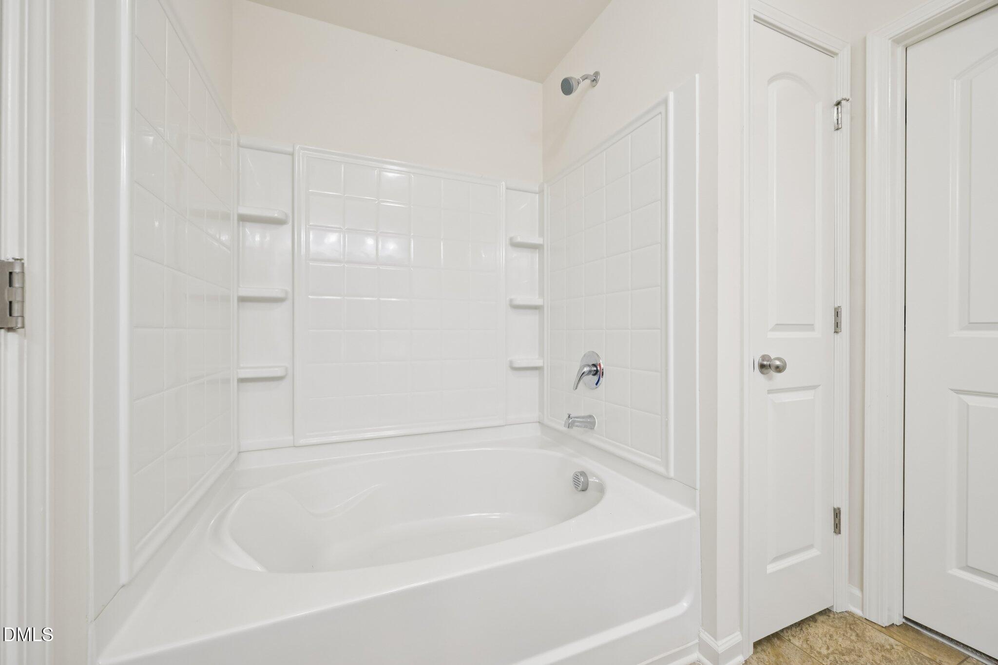 2020 Creek Road Nashville, NC 27856 - Photo 15 of 26 a white bath tub sitting next to a shower
