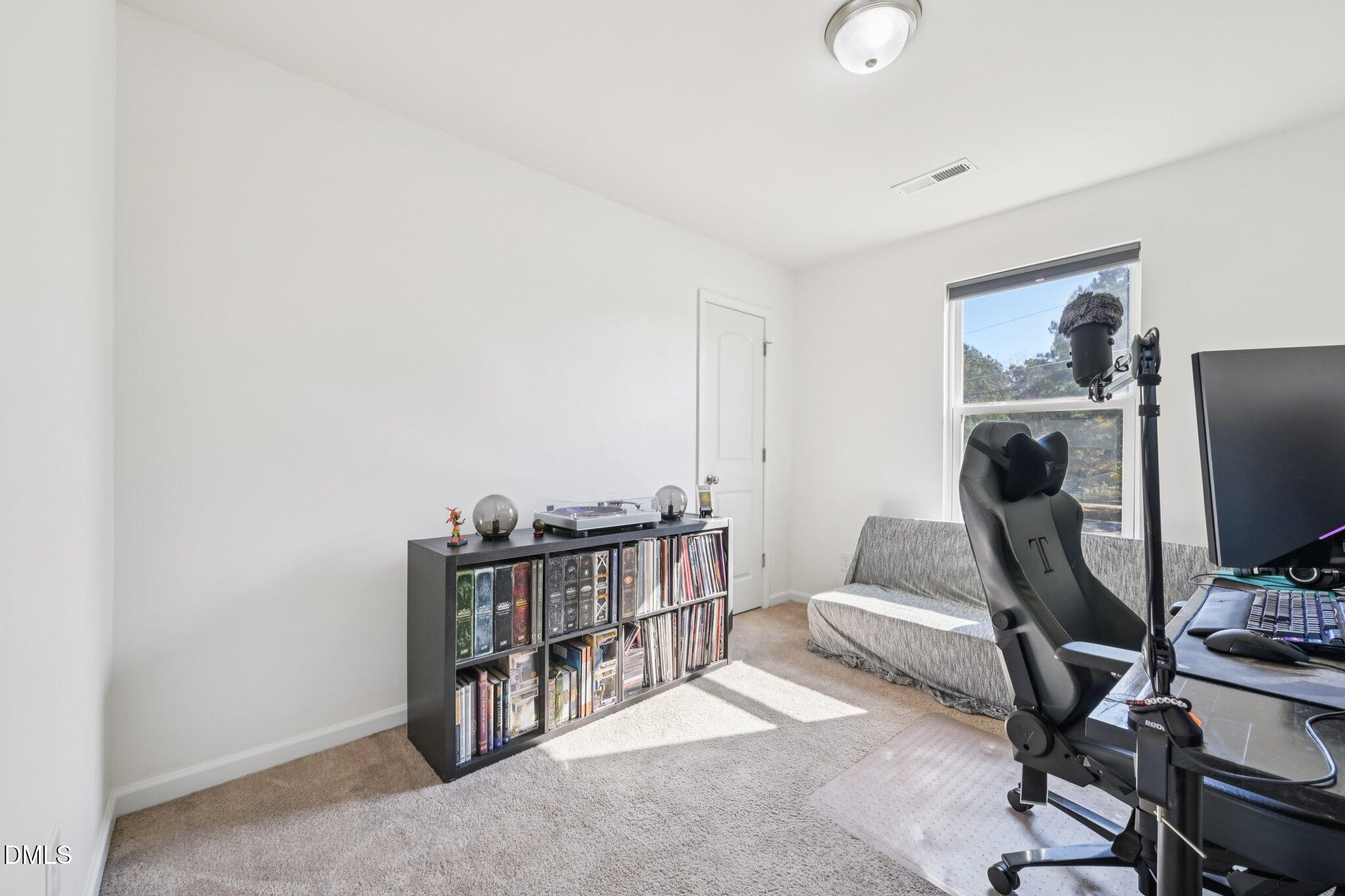 2020 Creek Road Nashville, NC 27856 - Photo 16 of 26 a view of a workspace with furniture and a window