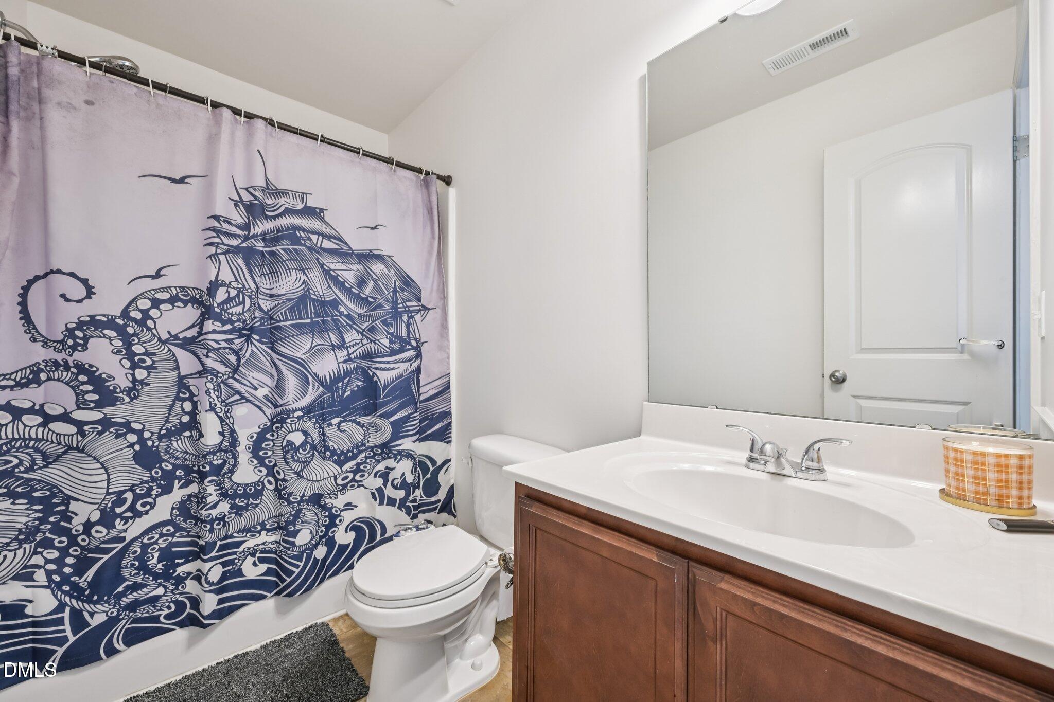2020 Creek Road Nashville, NC 27856 - Photo 18 of 26 a bathroom with a sink toilet and shower