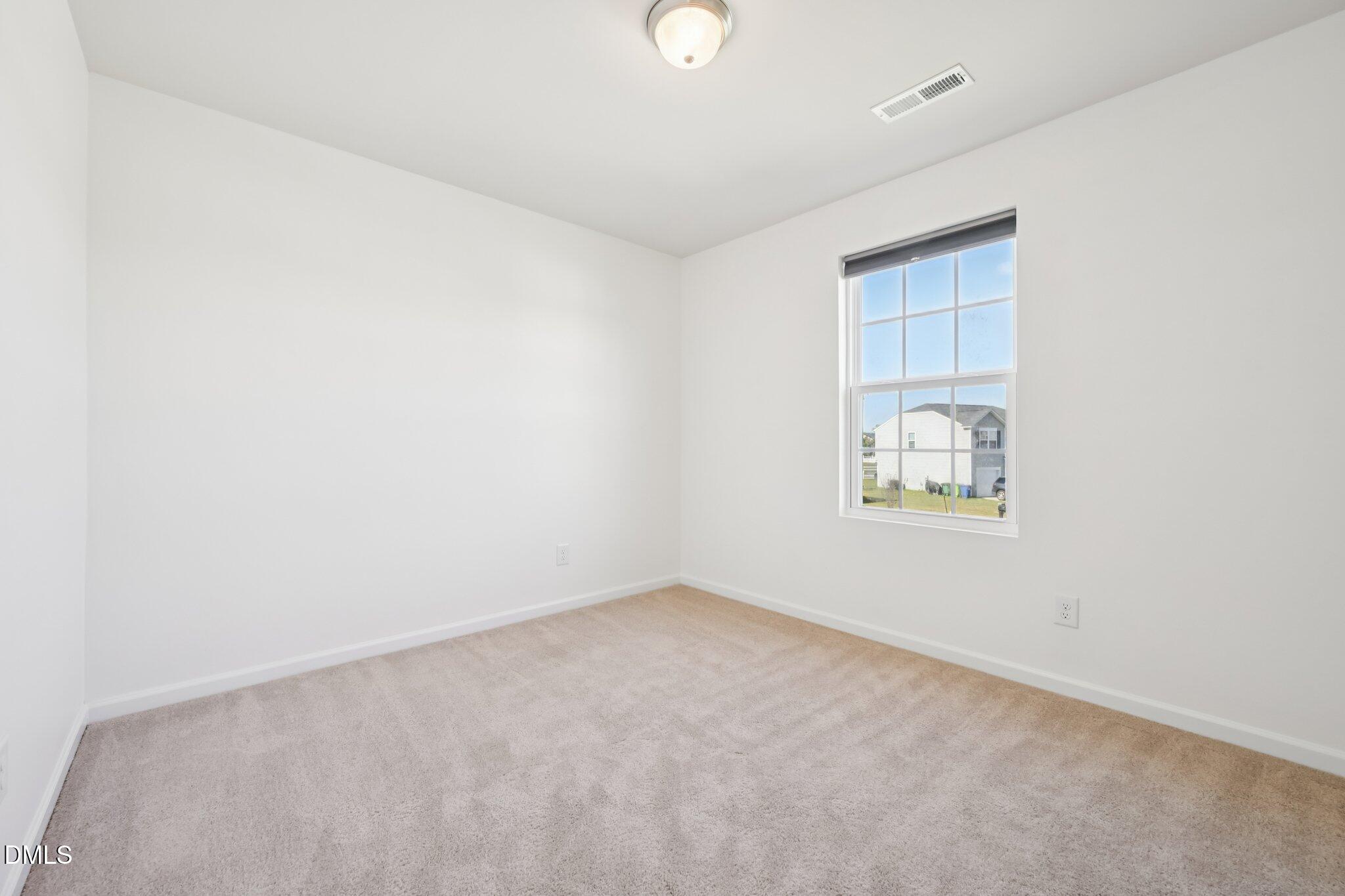 2020 Creek Road Nashville, NC 27856 - Photo 20 of 26 an empty room with windows