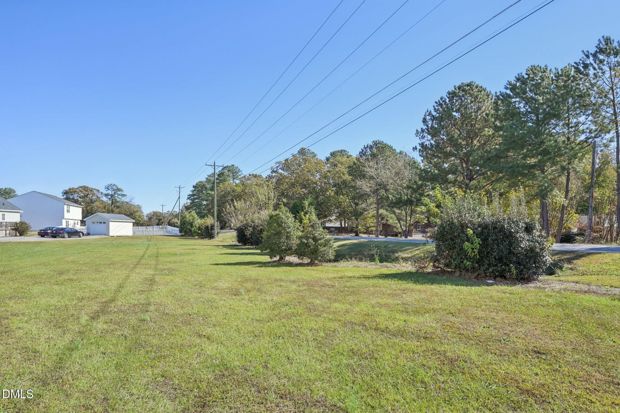 2020 Creek Road Nashville, NC 27856 - Photo 24 of 26 a view of a field of grass and trees