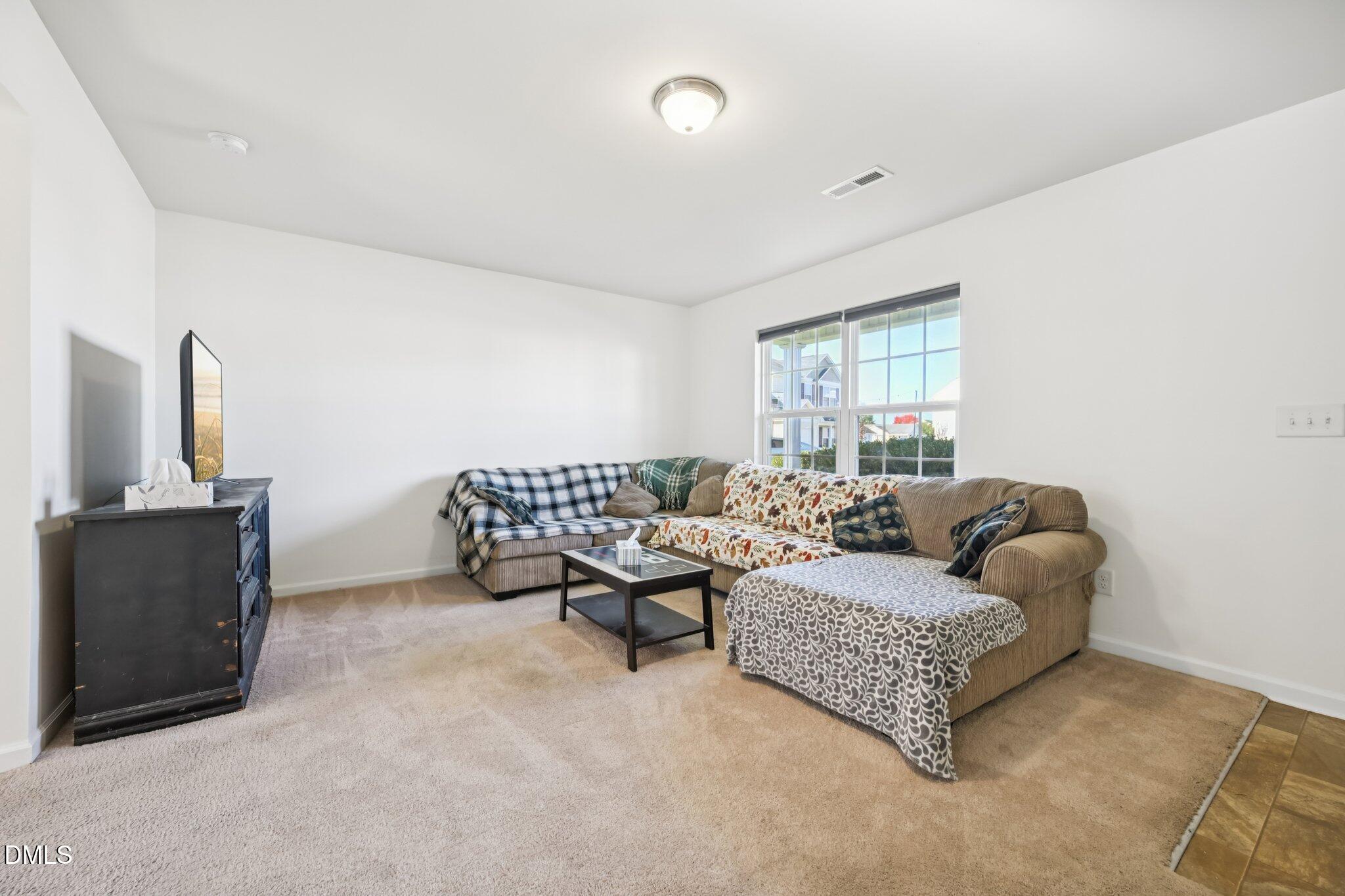 2020 Creek Road Nashville, NC 27856 - Photo 4 of 26 a living room with furniture and a window
