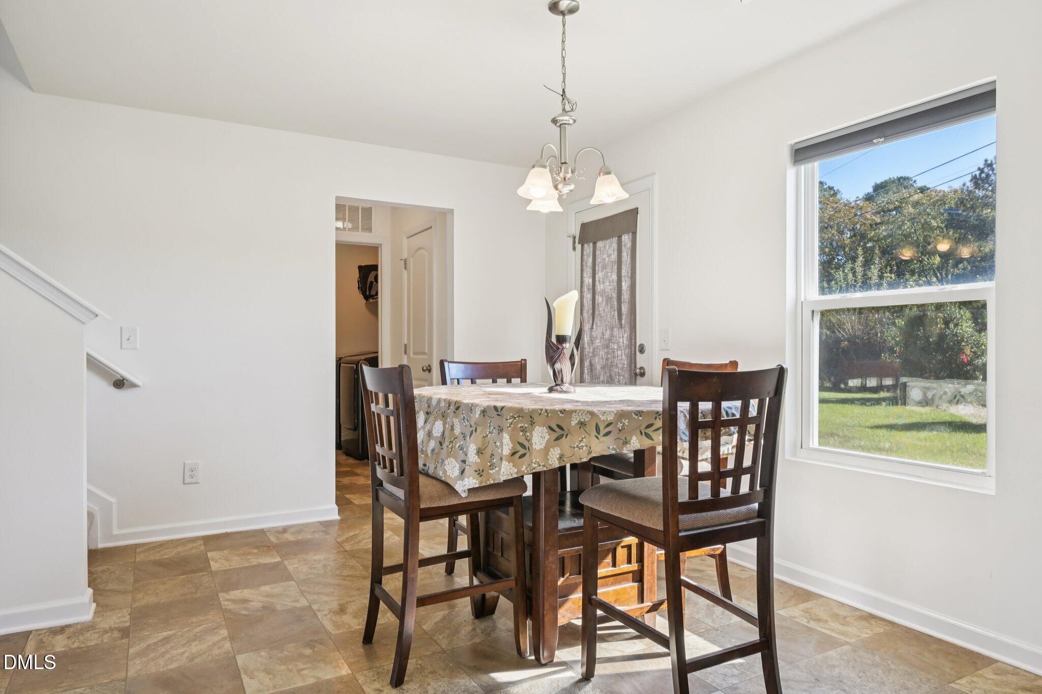 2020 Creek Road Nashville, NC 27856 - Photo 6 of 26 a view of a dining room with furniture window and outside view