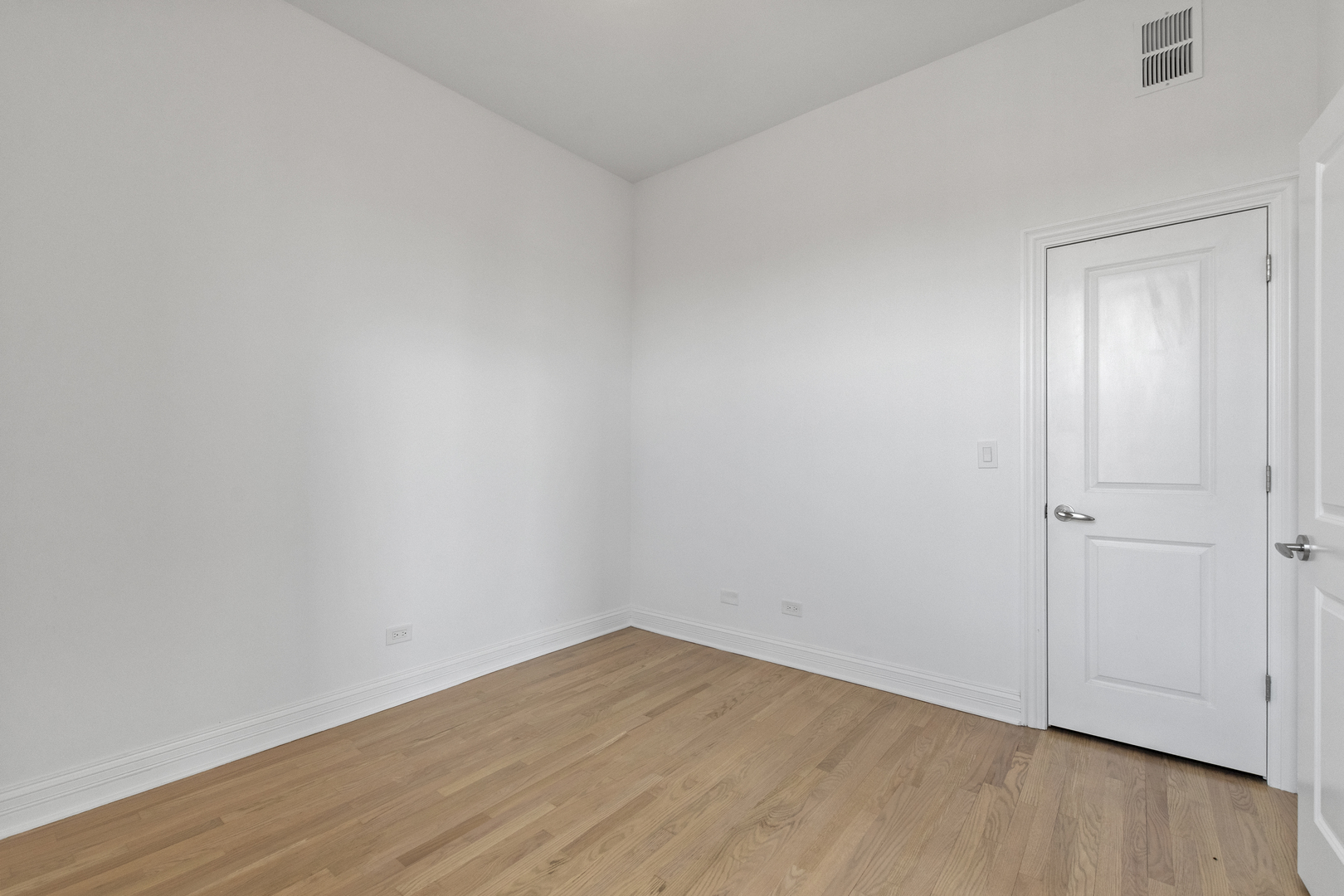 Undisclosed Address Chicago, IL 60622 - Photo 12 of 14 a view of an empty room with wooden floor