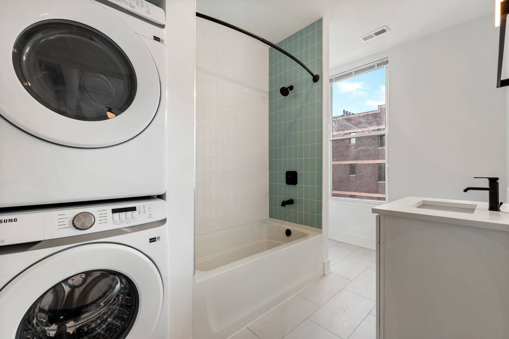 Undisclosed Address Chicago, IL 60622 - Photo 7 of 14 a bathroom with a sink a washer and dryer