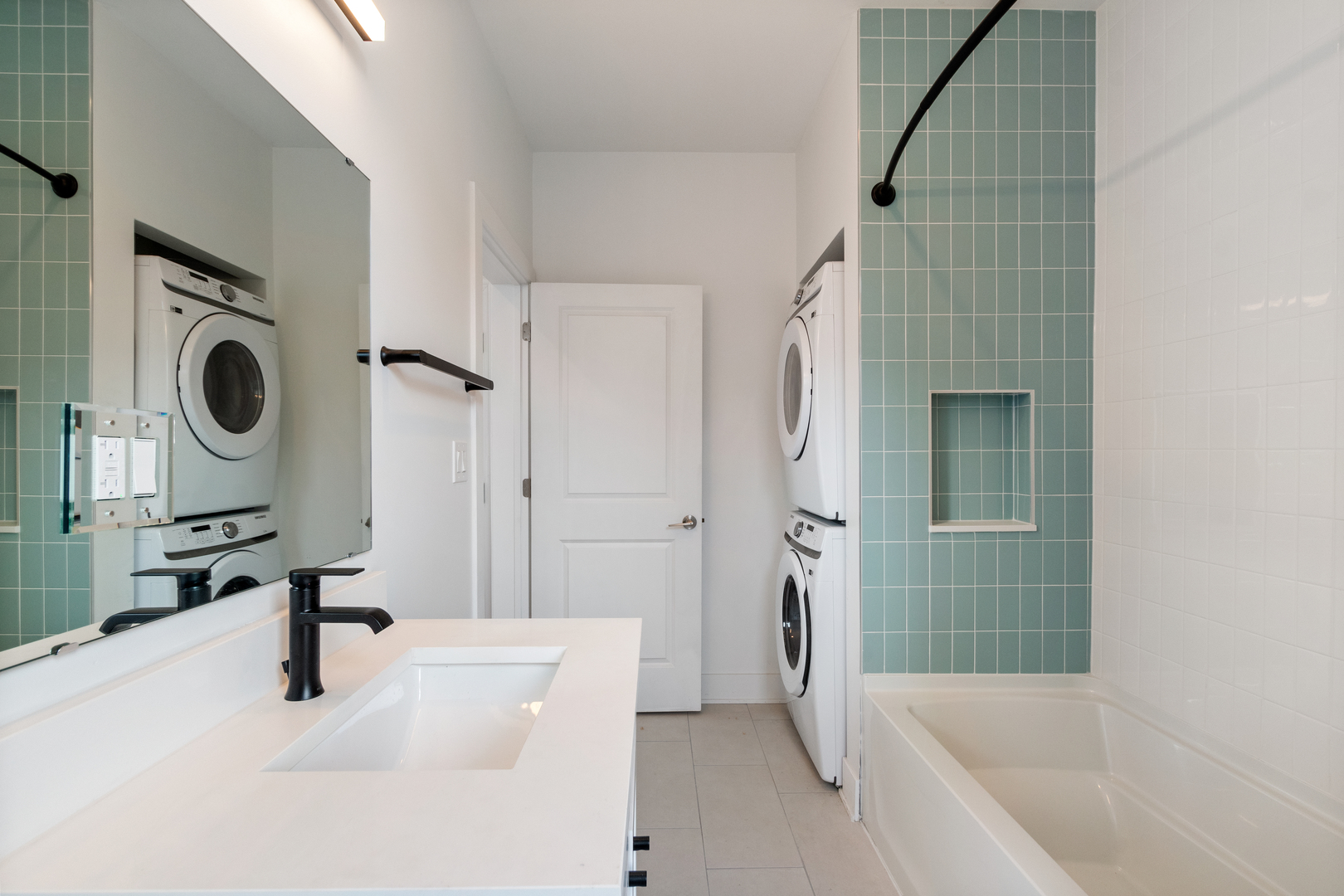 Undisclosed Address Chicago, IL 60622 - Photo 8 of 14 a bathroom with a sink a mirror and shower