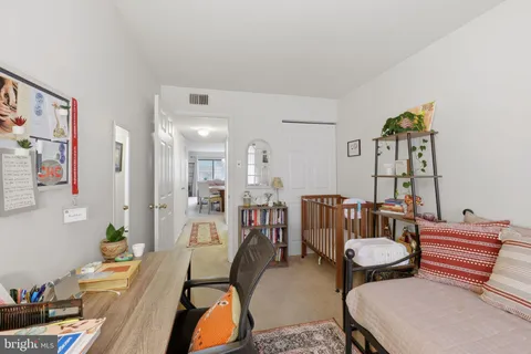 a room with furniture a rug and a table