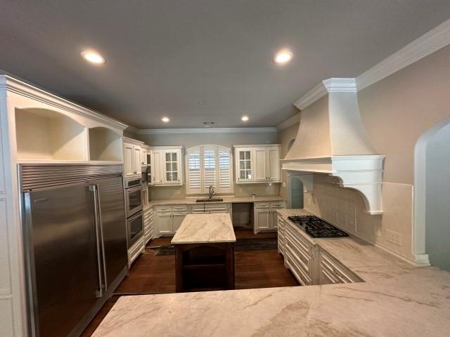 801 Glenmont Road Keller, TX 76248 - Photo 14 of 34 a kitchen with refrigerator and white cabinets