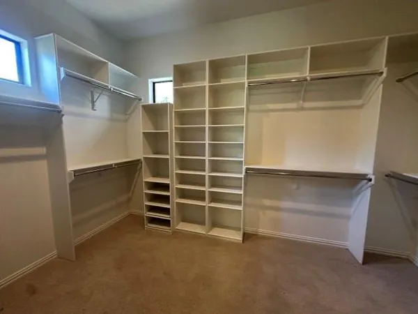 a view of an empty walk in closet