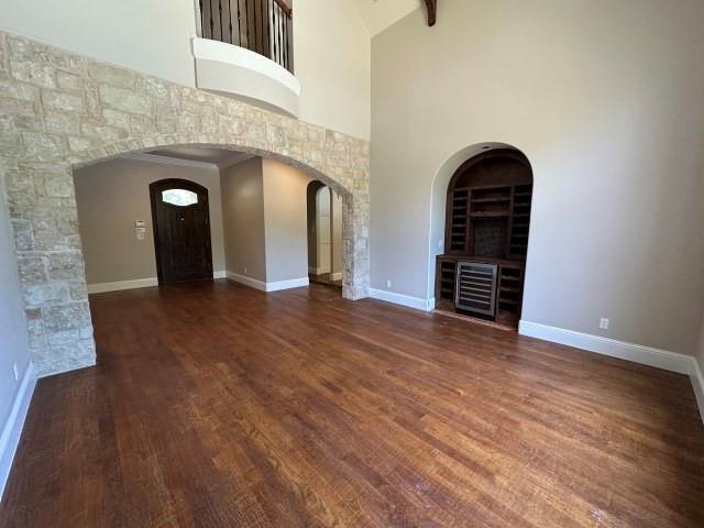 801 Glenmont Road Keller, TX 76248 - Photo 6 of 34 an empty room with wooden floor and mirror