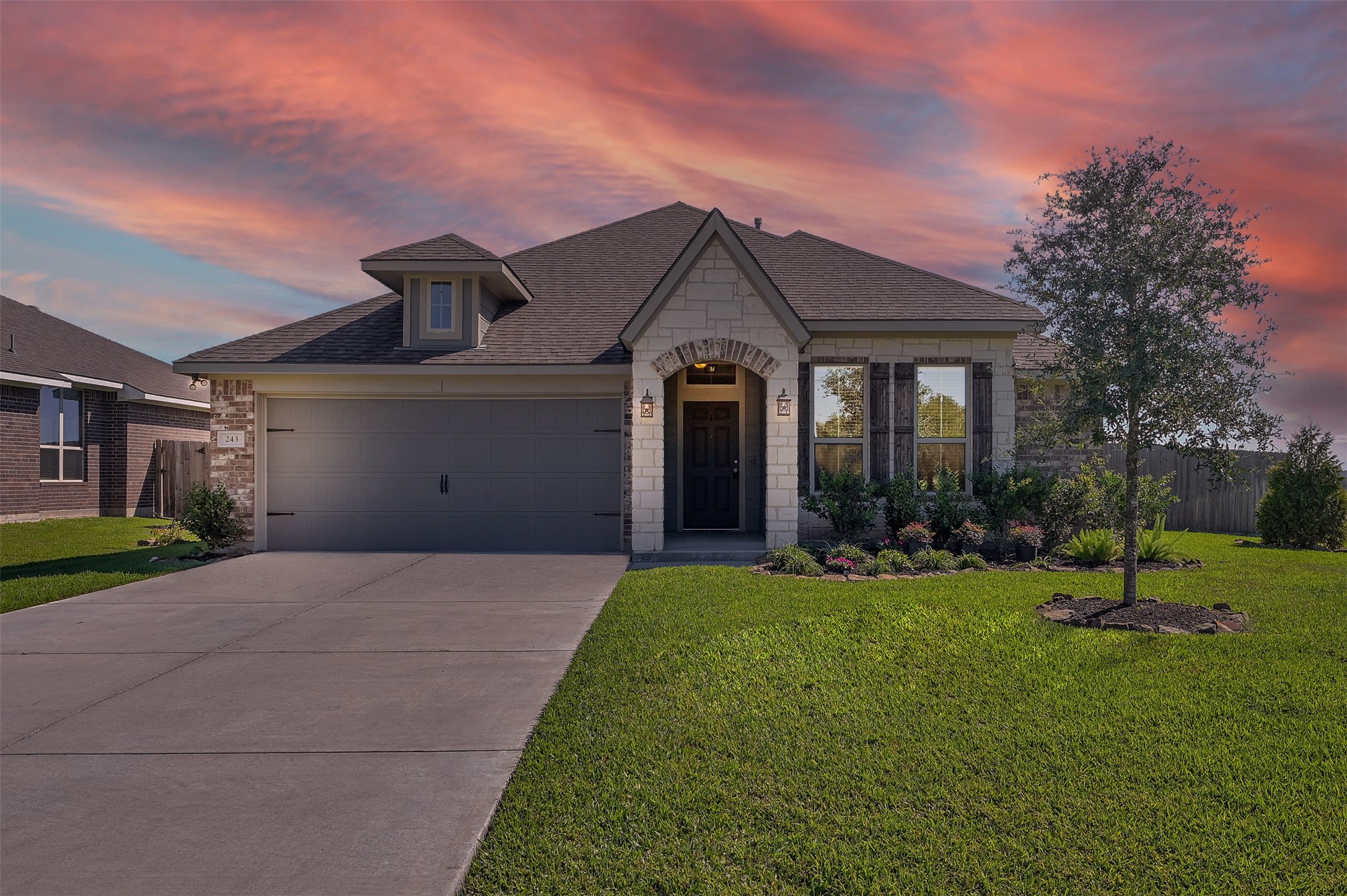 a front view of a house with a yard