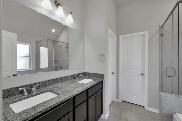 a bathroom with a bathtub and next to a window