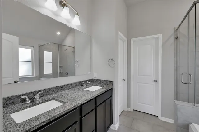 a bathroom with a bathtub and next to a window