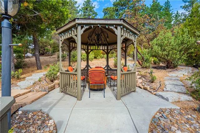a view of deck with table and chairs and wooden floor