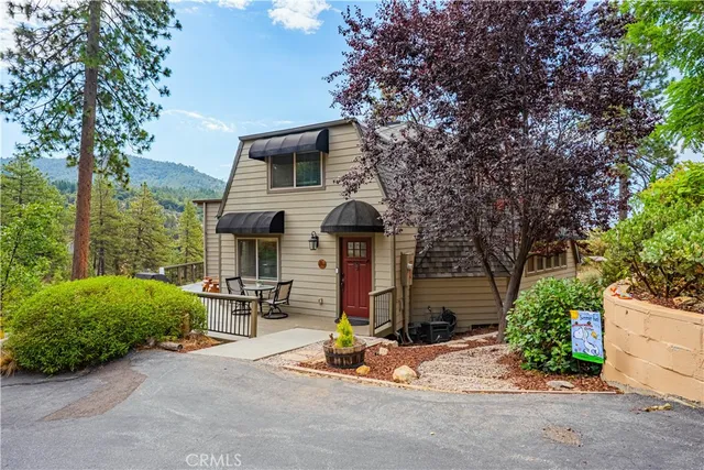 a view of a two chairs in the balcony