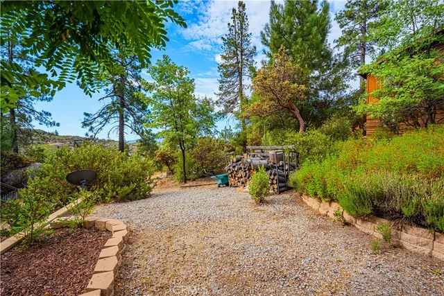 a kitchen with kitchen island granite countertop a sink counter space appliances and cabinets