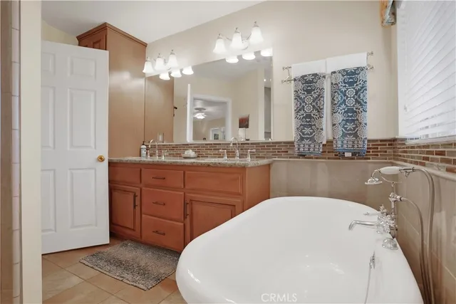 a bathroom with a granite countertop shower