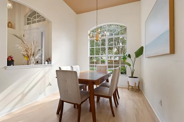 a view of a dining room with furniture window and outside view