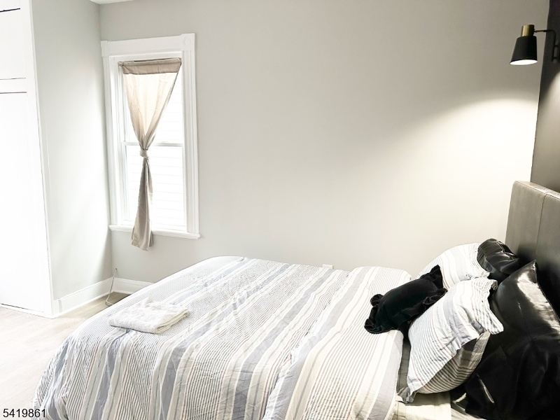 34 Duryea Street Newark, NJ 07103 - Photo 13 of 15 a bedroom with a bed and a window