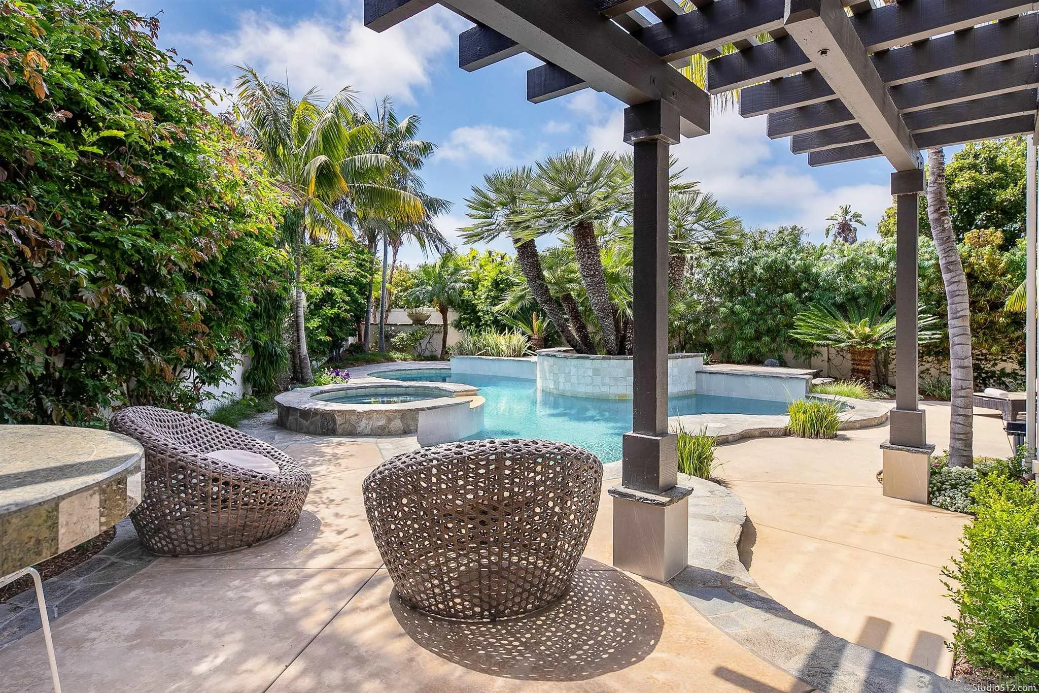 220 Jacob Lane Encinitas, CA 92024 - Photo 13 of 40 a view of a patio with lawn chairs next to a yard
