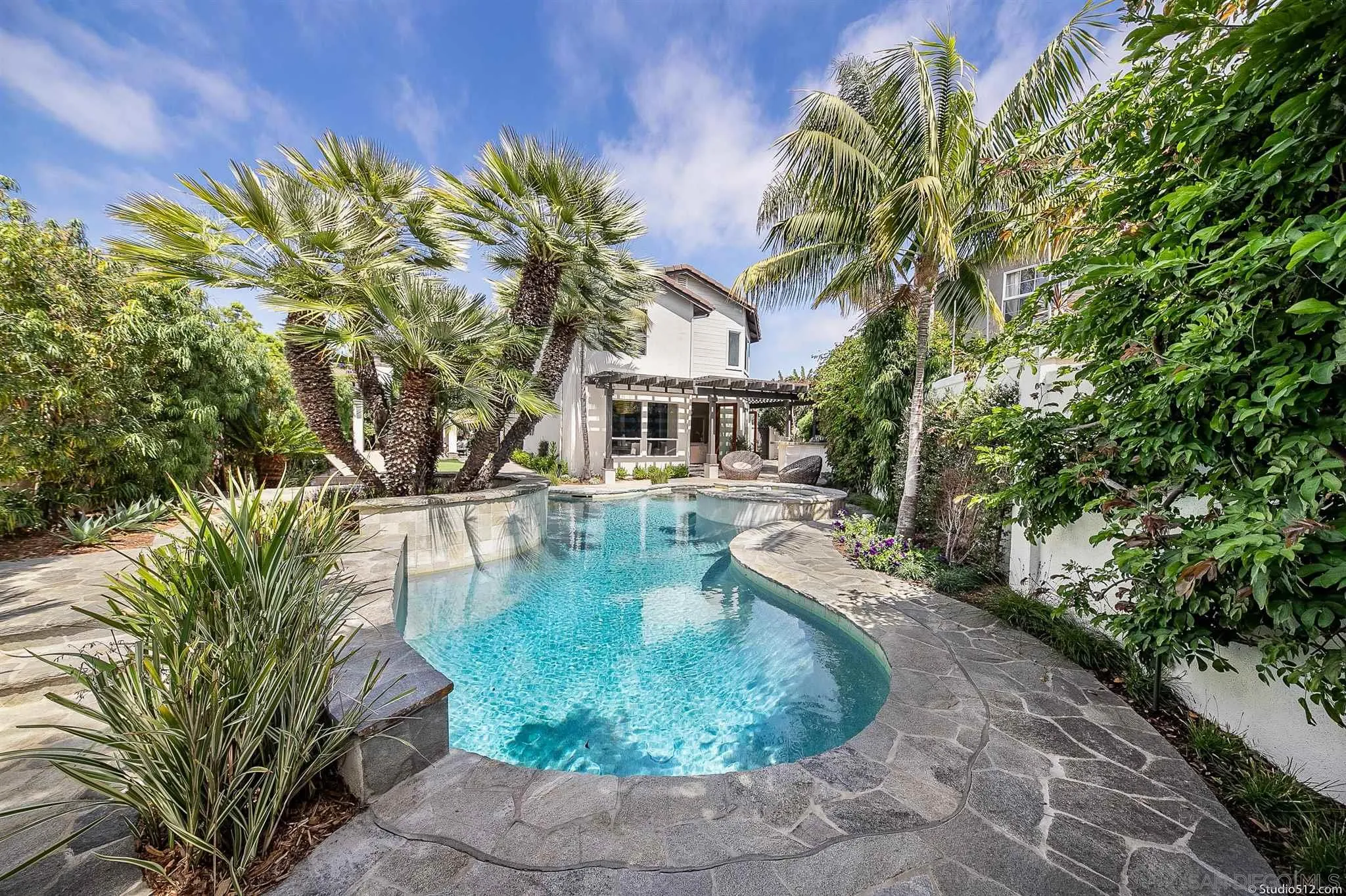 220 Jacob Lane Encinitas, CA 92024 - Photo 14 of 40 a view of a house with pool plants and large trees