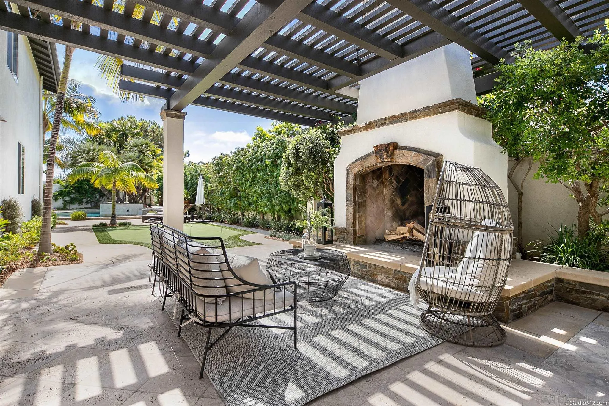 220 Jacob Lane Encinitas, CA 92024 - Photo 18 of 40 a view of a patio with a table and chairs and a barbeque