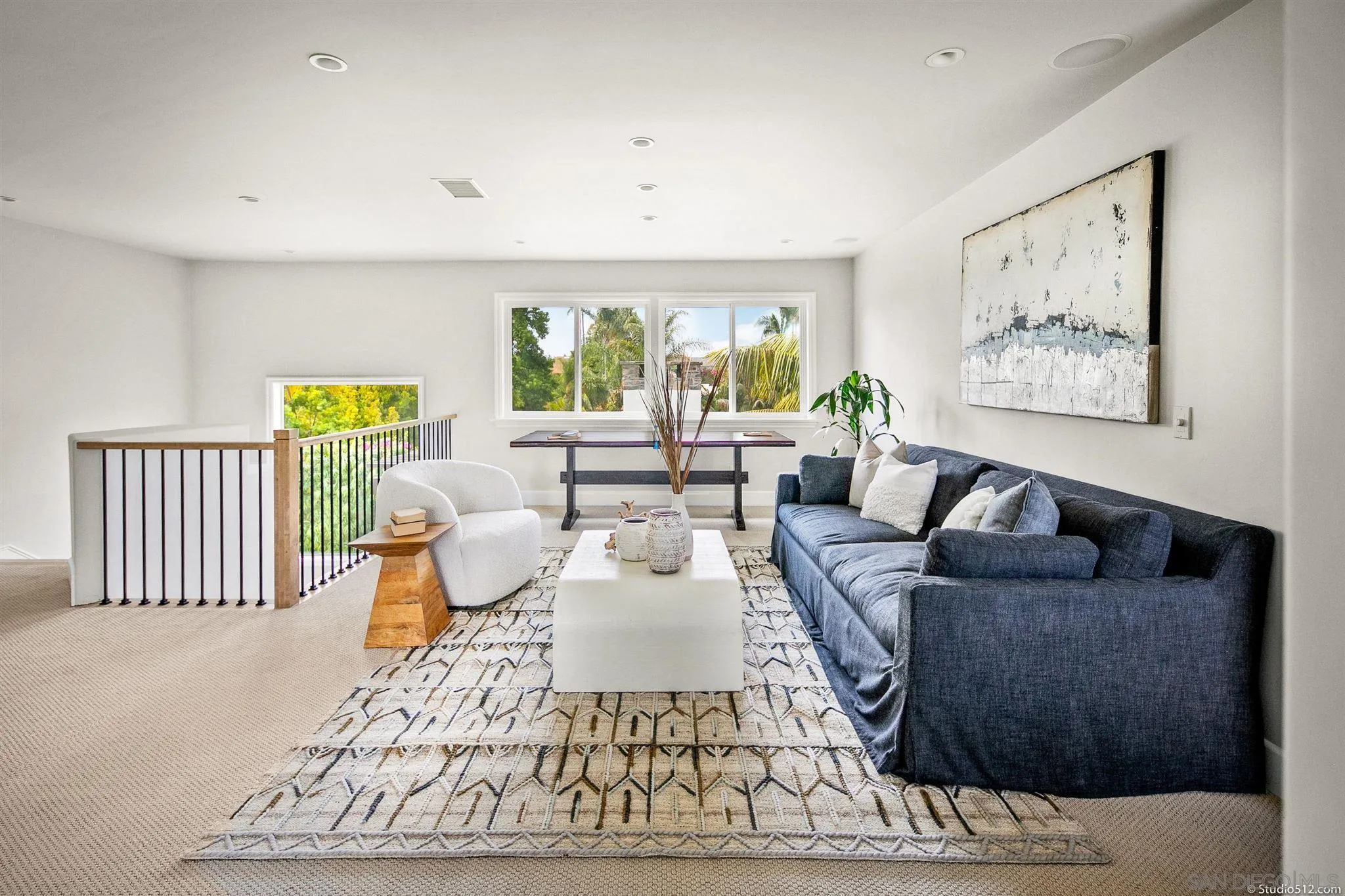 220 Jacob Lane Encinitas, CA 92024 - Photo 29 of 40 a living room with furniture and a large window