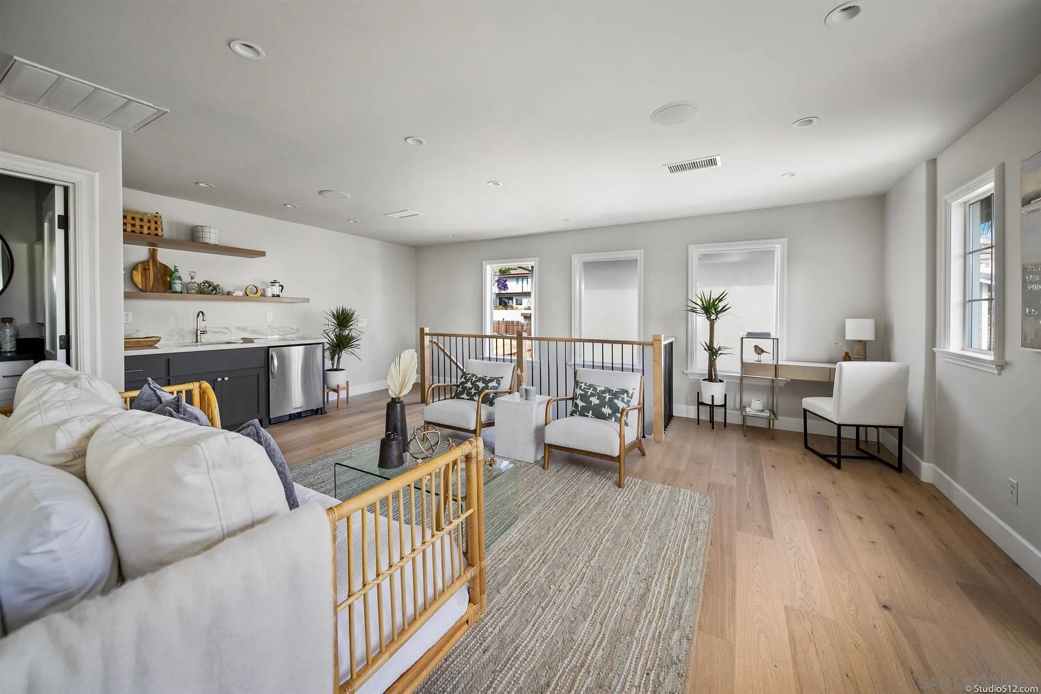 220 Jacob Lane Encinitas, CA 92024 - Photo 30 of 40 a living room with furniture and a wooden floor