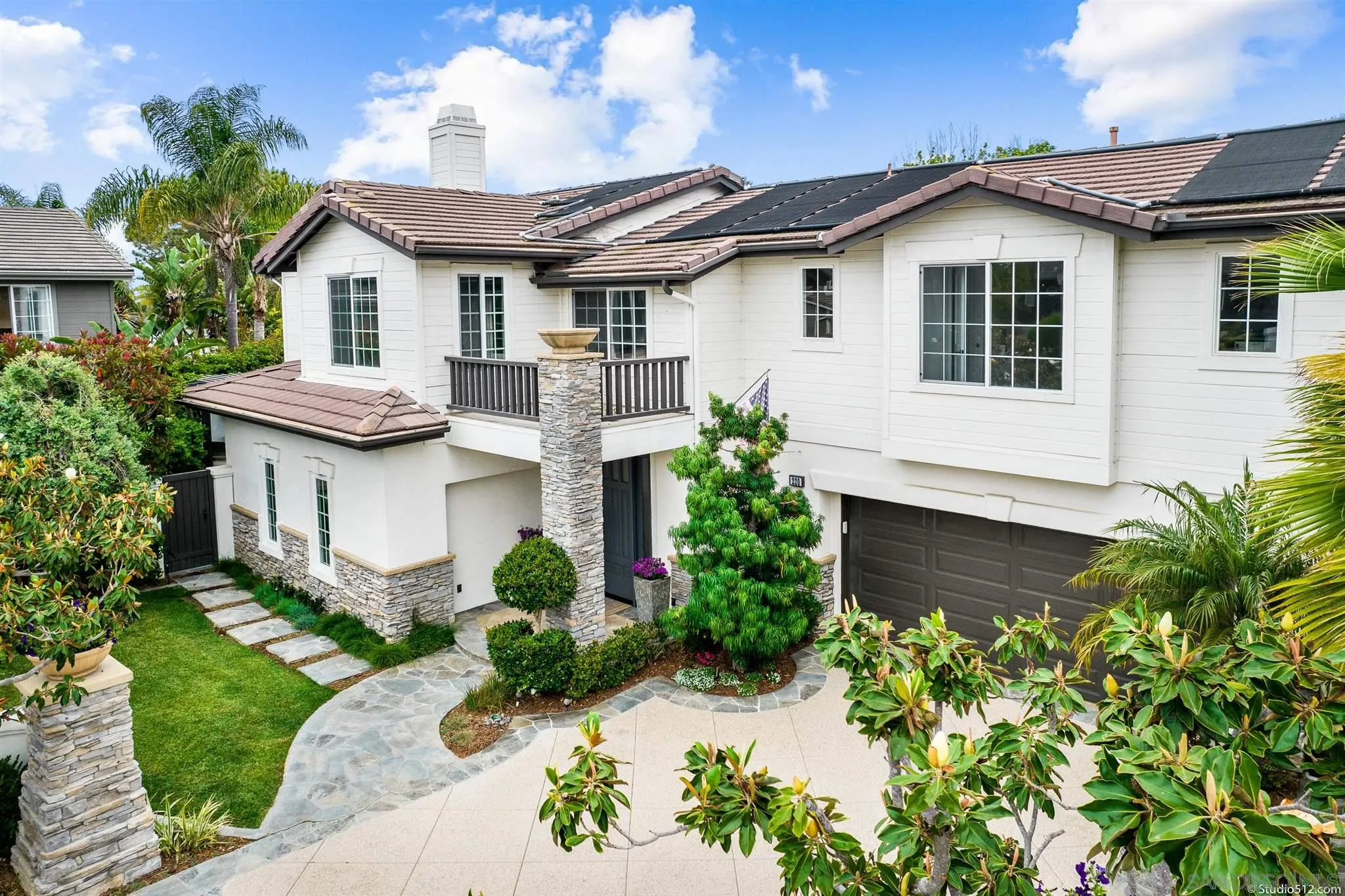 220 Jacob Lane Encinitas, CA 92024 - Photo 32 of 40 a front view of a house with a garden