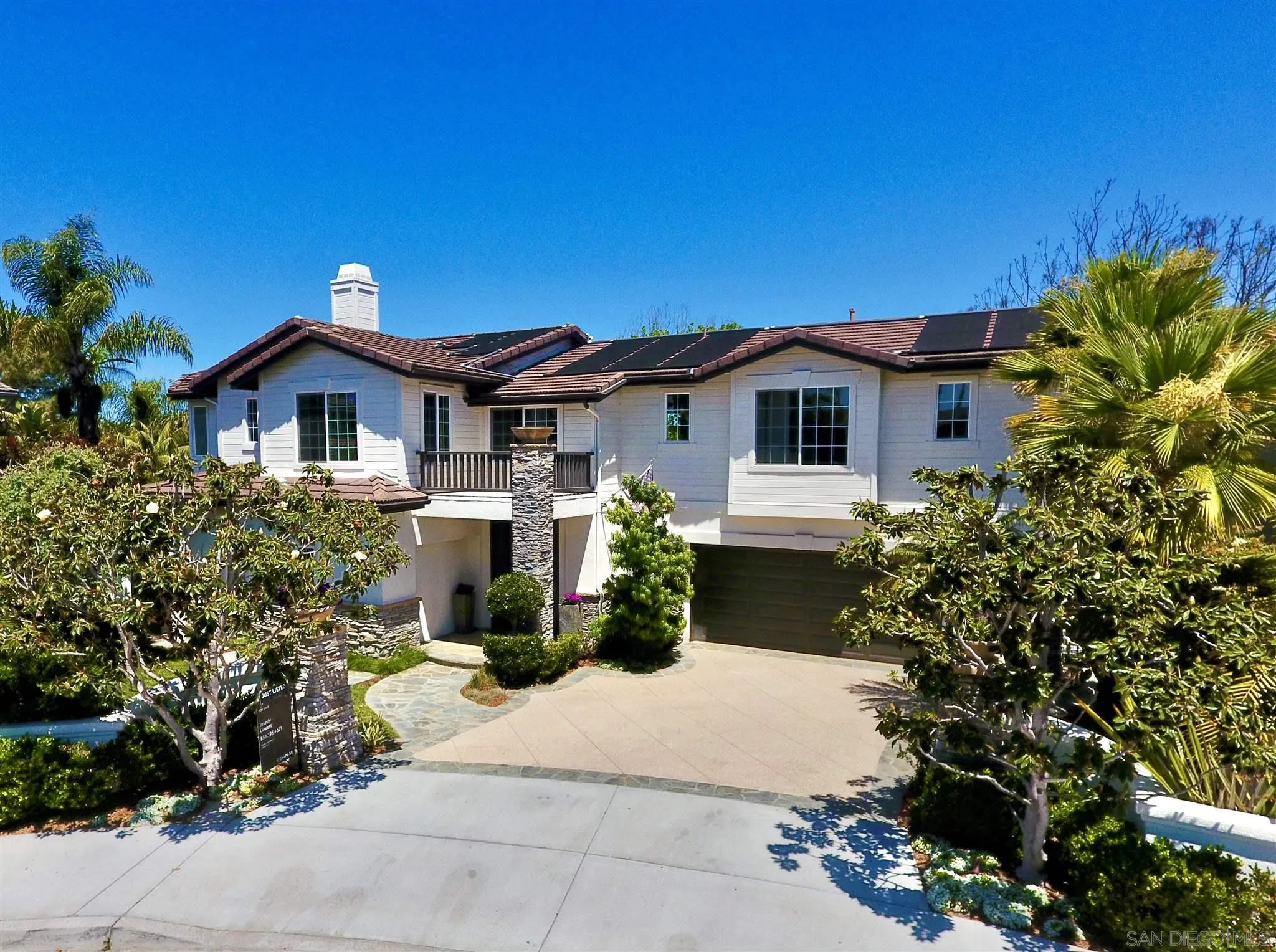 220 Jacob Lane Encinitas, CA 92024 - Photo 33 of 40 a front view of a house with a garden