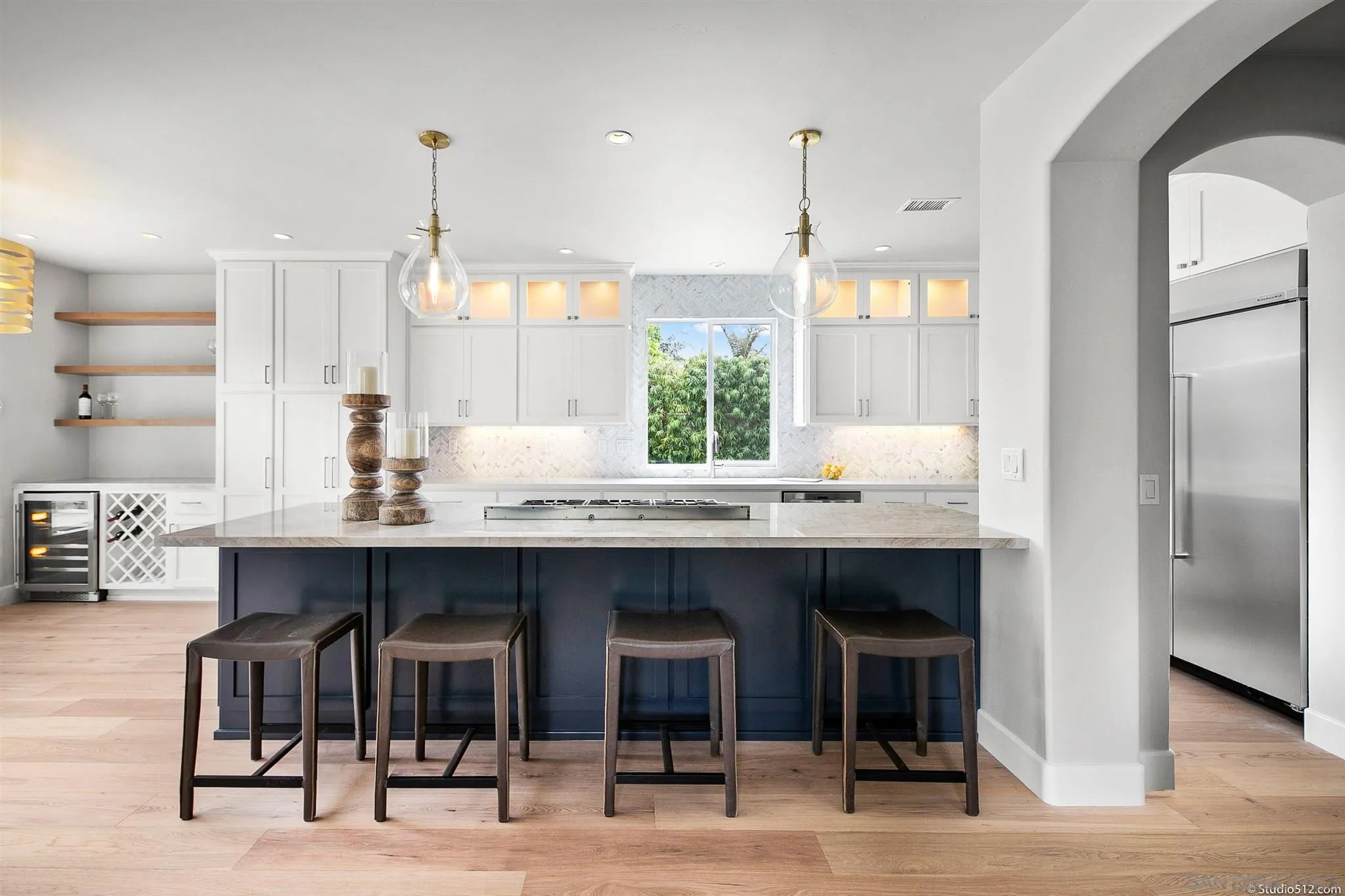 220 Jacob Lane Encinitas, CA 92024 - Photo 7 of 40 a kitchen with a table chairs refrigerator and sink