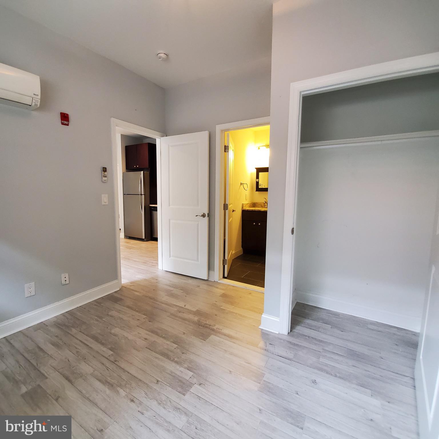 421-429 Monroe Street, Unit 102 Philadelphia, PA 19147 - Photo 5 of 10 a view of empty room with wooden floor