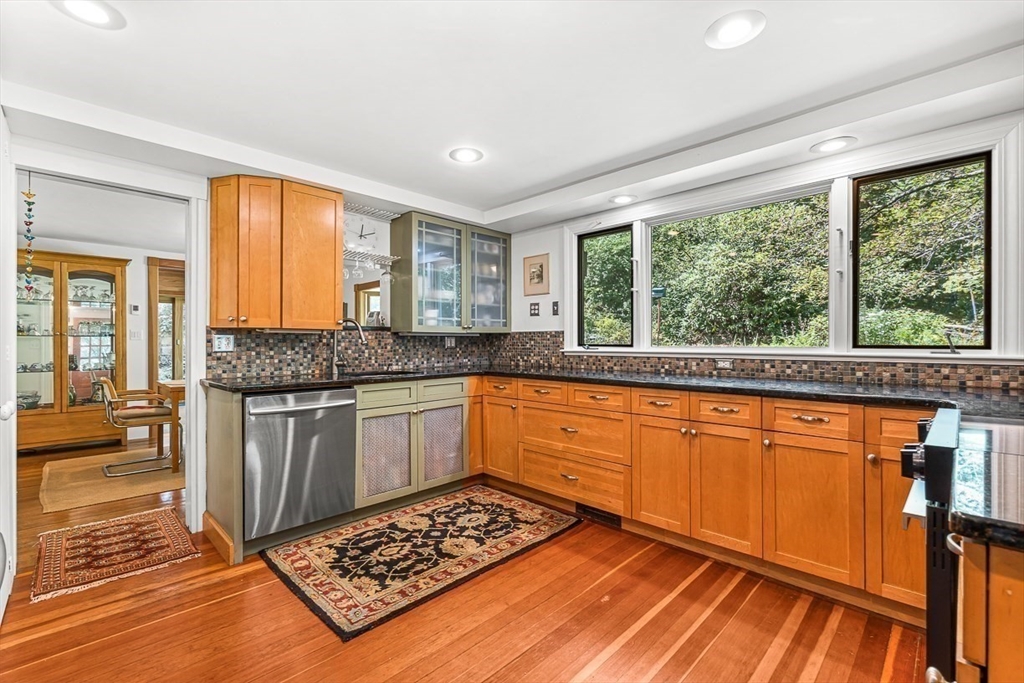 55 Pleasant Street Lexington, MA 02421 - Photo 13 of 42 a kitchen with stainless steel appliances granite countertop a stove a sink and a microwave