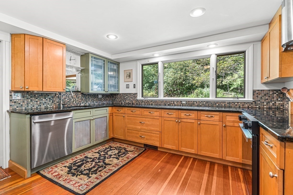 55 Pleasant Street Lexington, MA 02421 - Photo 15 of 42 a kitchen with stainless steel appliances granite countertop a stove a sink and a microwave