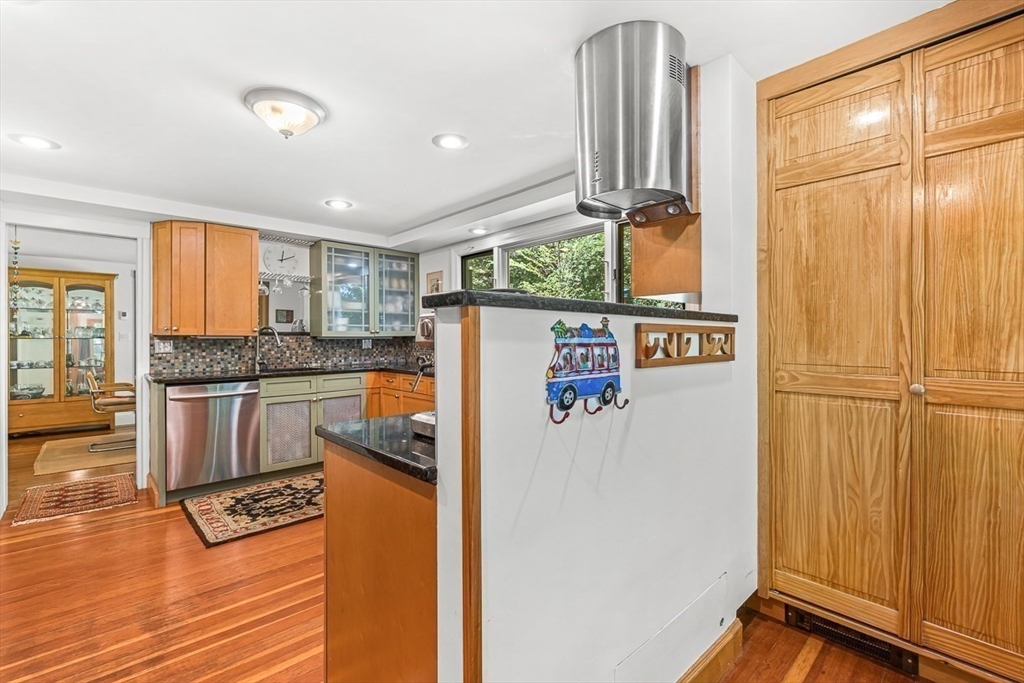 55 Pleasant Street Lexington, MA 02421 - Photo 17 of 42 a kitchen with a refrigerator and countertop cabinets