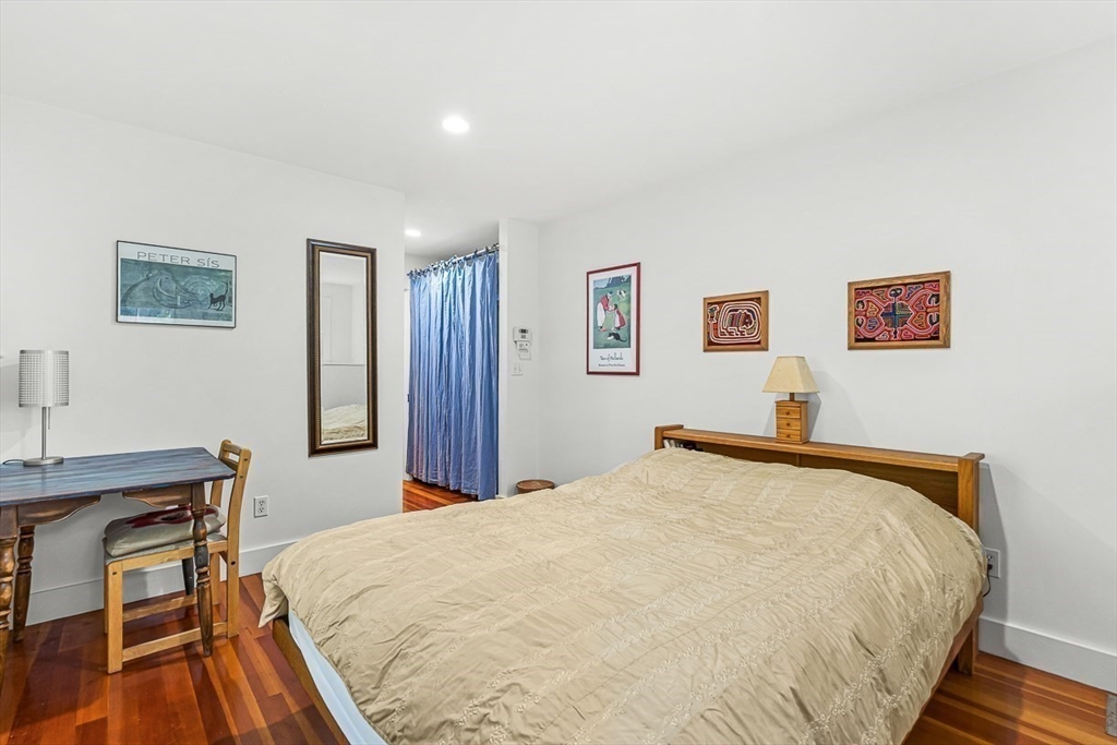 55 Pleasant Street Lexington, MA 02421 - Photo 22 of 42 a bedroom with a bed and a desk