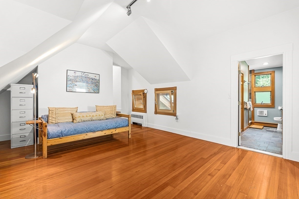 55 Pleasant Street Lexington, MA 02421 - Photo 30 of 42 a bedroom with furniture and wooden floor