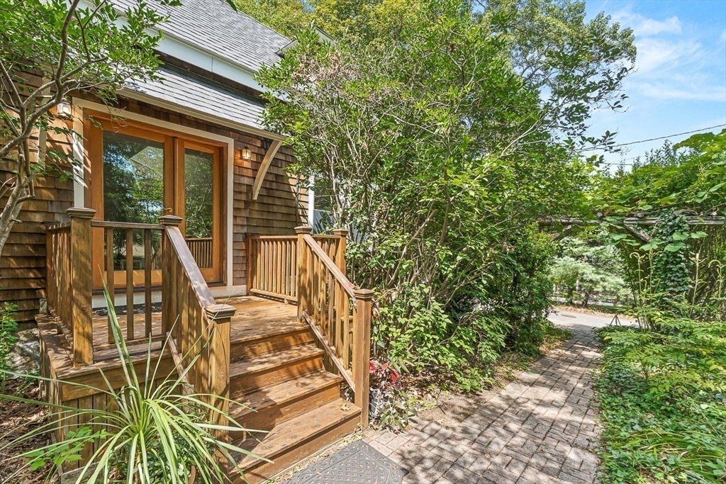 55 Pleasant Street Lexington, MA 02421 - Photo 3 of 42 a view of balcony with wooden floor and fence