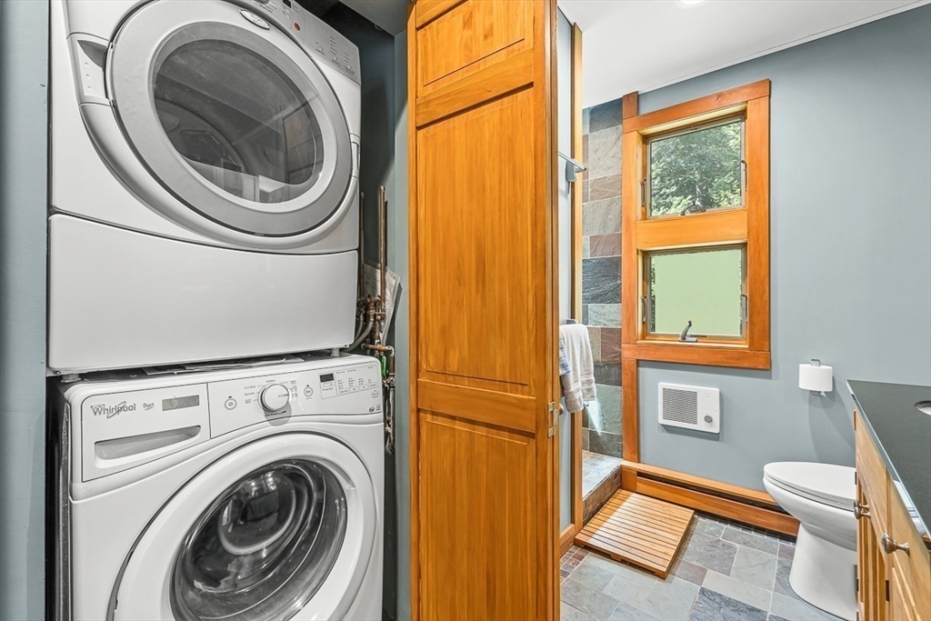 55 Pleasant Street Lexington, MA 02421 - Photo 32 of 42 a view of a bedroom with washer and dryer