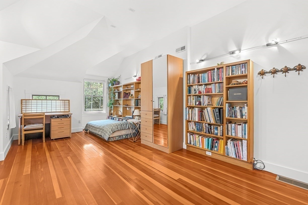 55 Pleasant Street Lexington, MA 02421 - Photo 33 of 42 a living room with furniture and a book shelf